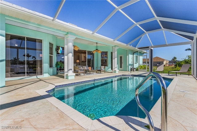 view of pool with a lanai and a patio