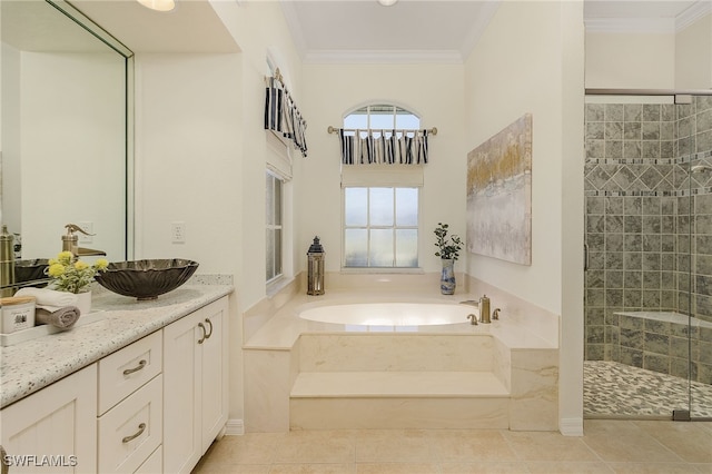 bathroom with independent shower and bath, vanity, ornamental molding, and tile patterned flooring