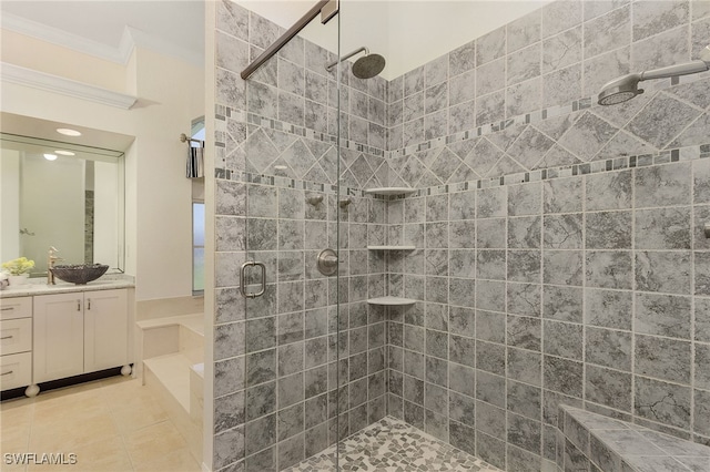 bathroom with tile patterned floors, an enclosed shower, vanity, and crown molding