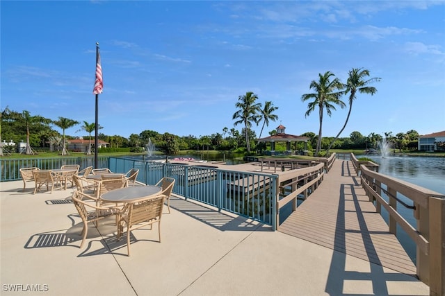 view of swimming pool featuring a gazebo and a water view