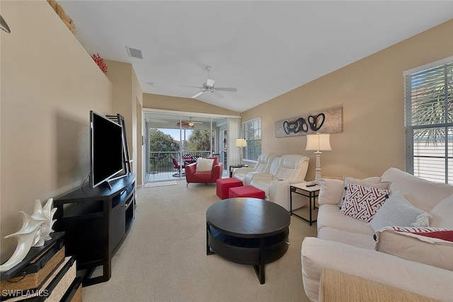 carpeted living room with lofted ceiling and ceiling fan