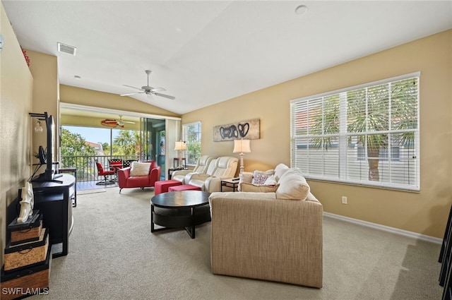 living room featuring ceiling fan, light colored carpet, and lofted ceiling