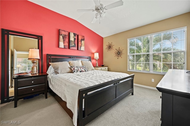 carpeted bedroom featuring lofted ceiling and ceiling fan