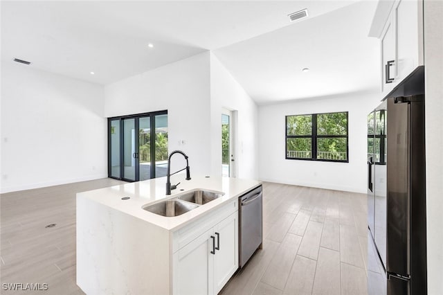 kitchen with light hardwood / wood-style flooring, a kitchen island with sink, white cabinetry, sink, and stainless steel appliances