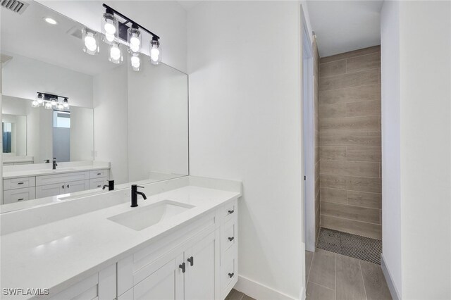 bathroom featuring dual vanity