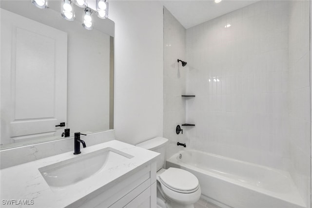 full bathroom featuring tiled shower / bath combo, toilet, and vanity