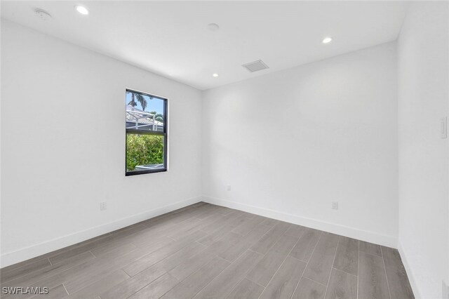 unfurnished room with light hardwood / wood-style flooring