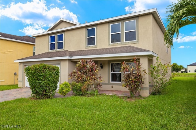 view of front property with a garage and a front lawn