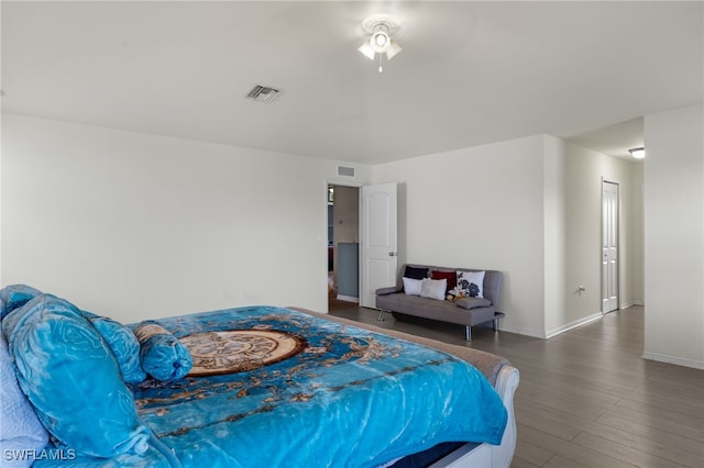 bedroom with ceiling fan and hardwood / wood-style floors