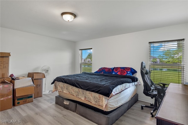 bedroom with light wood-type flooring