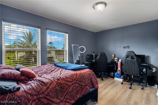 bedroom with light wood-type flooring