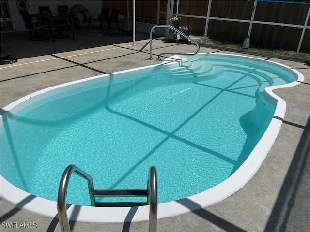 view of swimming pool featuring a patio