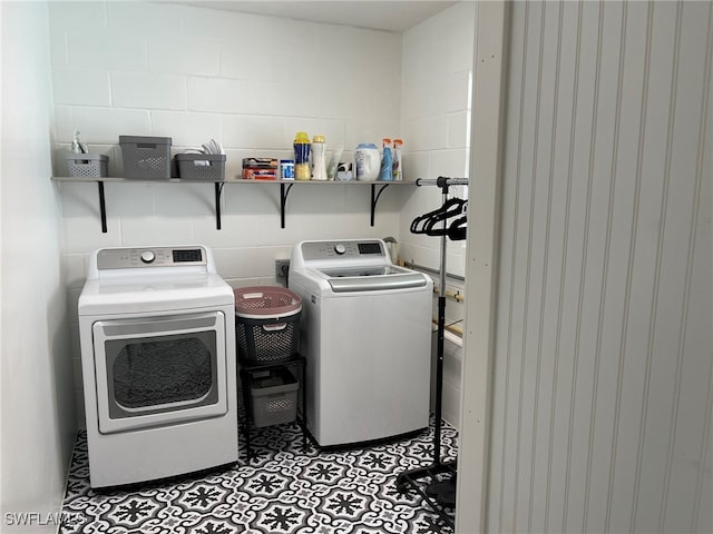 clothes washing area with washer and dryer