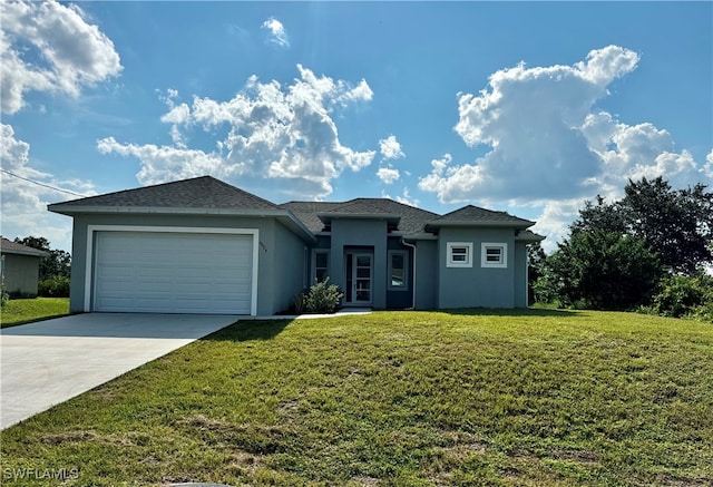 view of front facade with a garage and a front yard