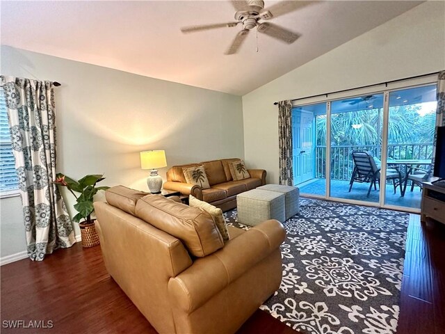 living room featuring ceiling fan, dark hardwood / wood-style floors, and lofted ceiling