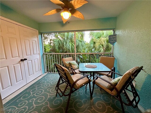 sunroom / solarium with ceiling fan