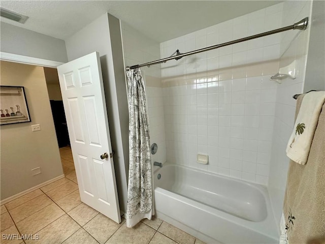 full bathroom with visible vents, shower / bathtub combination with curtain, and tile patterned floors