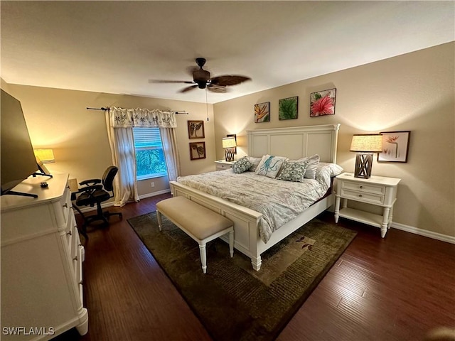 bedroom featuring dark wood-style floors, ceiling fan, and baseboards