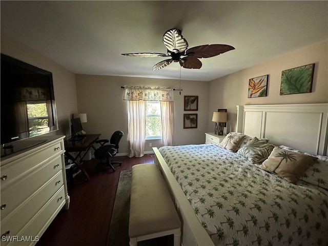 bedroom with ceiling fan and dark hardwood / wood-style flooring