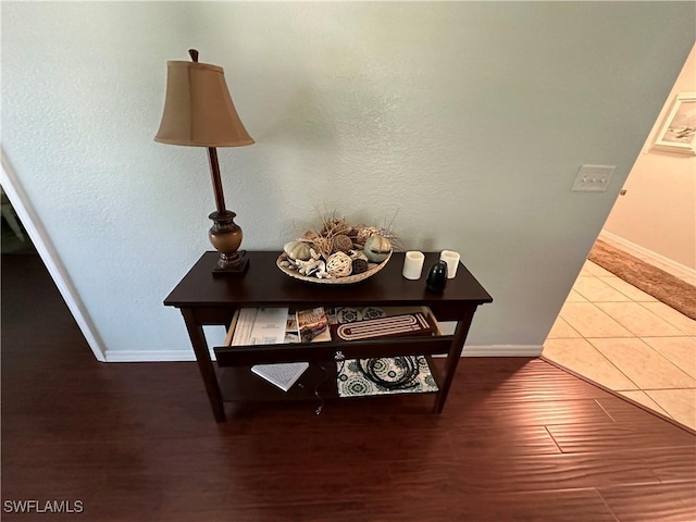 interior details featuring baseboards and wood finished floors