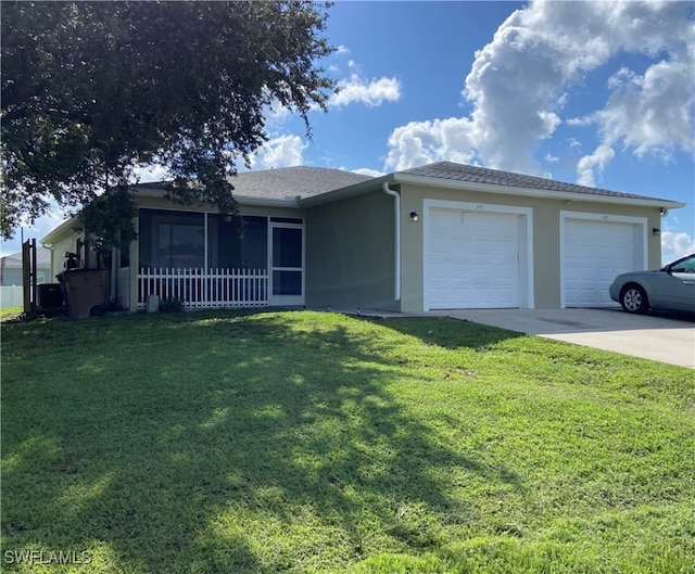 ranch-style home with a garage and a front lawn