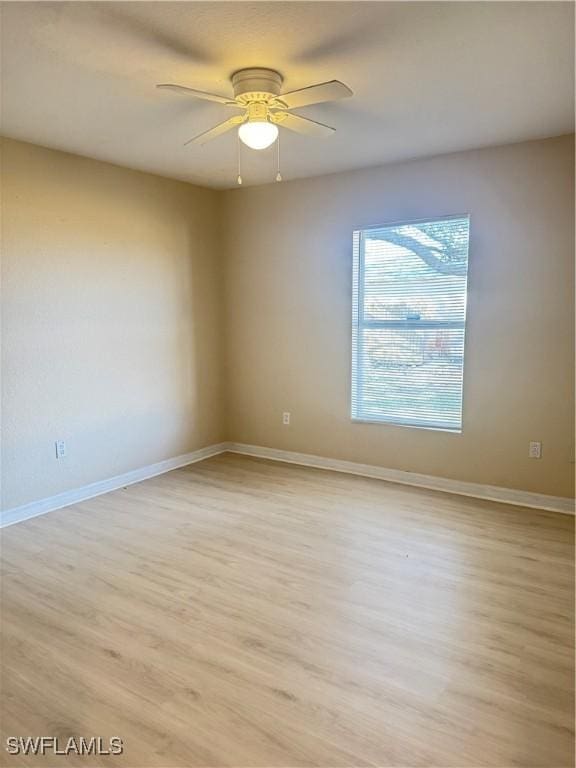 unfurnished room featuring ceiling fan and light hardwood / wood-style flooring