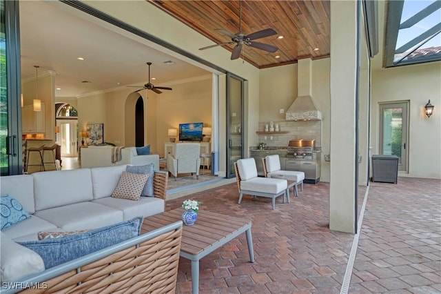 view of patio / terrace featuring ceiling fan, an outdoor kitchen, and an outdoor hangout area