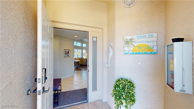 property entrance with stucco siding