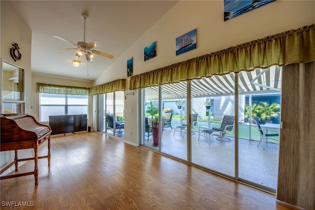 interior space with hardwood / wood-style flooring, high vaulted ceiling, and ceiling fan