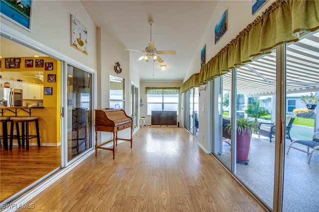 interior space with ceiling fan