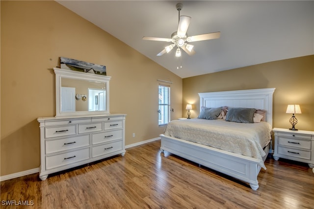 bedroom with hardwood / wood-style flooring, lofted ceiling, and ceiling fan