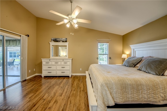 bedroom featuring ceiling fan, lofted ceiling, hardwood / wood-style floors, and access to outside