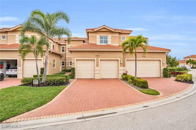 mediterranean / spanish-style house featuring a garage