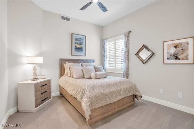 bedroom with ceiling fan and light carpet