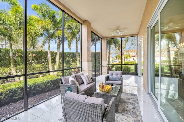 sunroom featuring ceiling fan