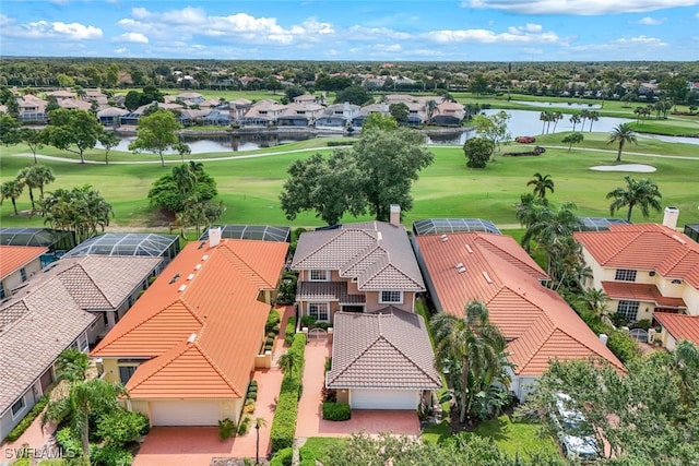 birds eye view of property featuring a water view, a residential view, and golf course view