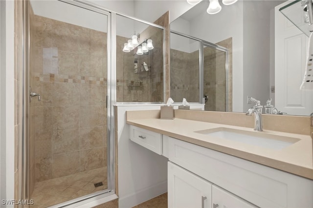 bathroom with vanity and an enclosed shower