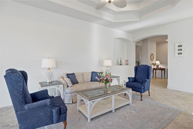 tiled living room featuring ceiling fan