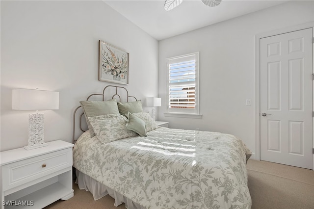 bedroom featuring light carpet