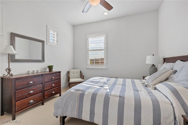 carpeted bedroom featuring ceiling fan