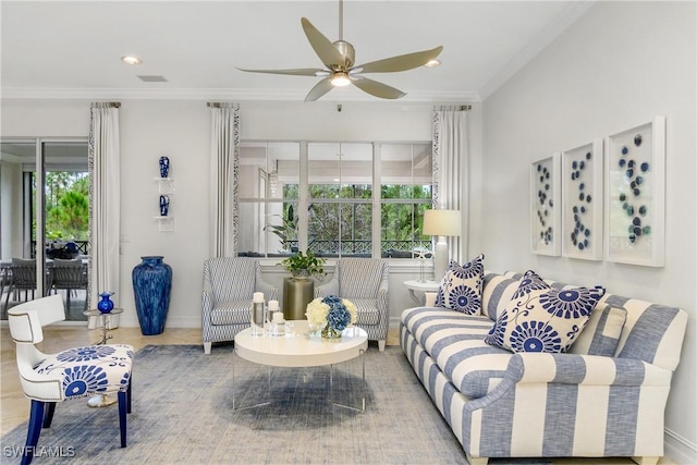 living area with visible vents, recessed lighting, a ceiling fan, and crown molding