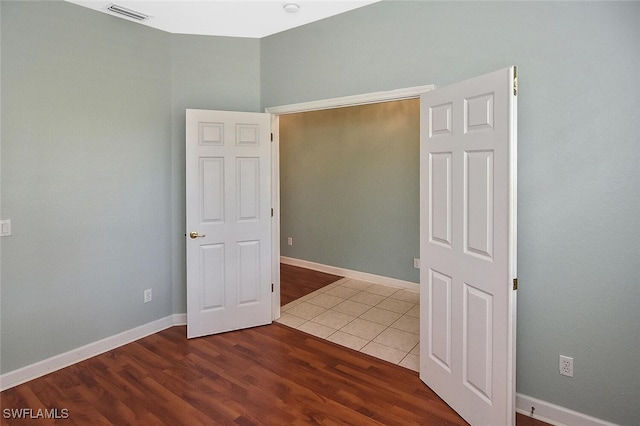 empty room with wood-type flooring