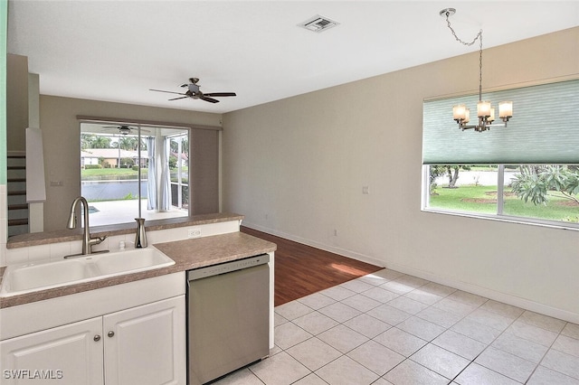 kitchen with sink, light hardwood / wood-style flooring, ceiling fan with notable chandelier, dishwasher, and white cabinetry