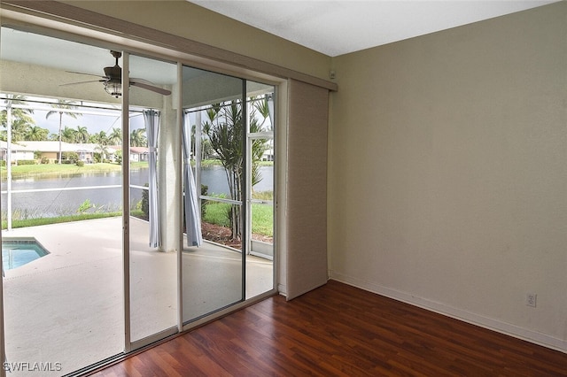 doorway featuring ceiling fan and wood-type flooring