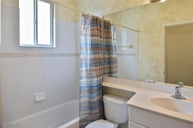 full bathroom featuring toilet, vanity, and shower / bathtub combination with curtain