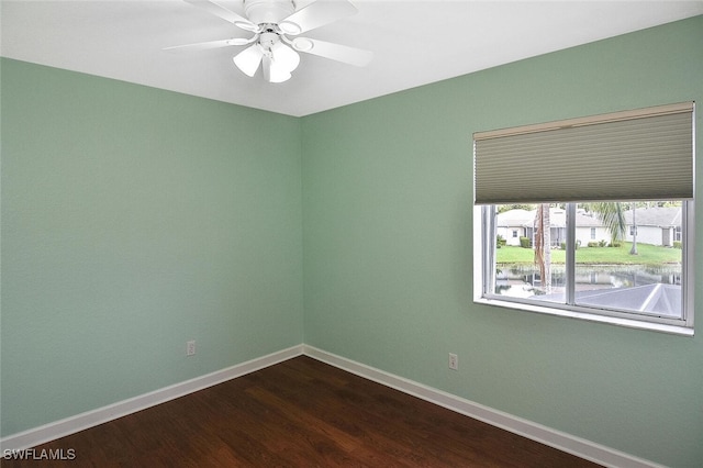 spare room featuring hardwood / wood-style floors and ceiling fan