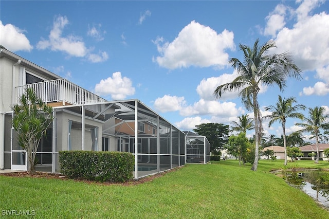 view of yard featuring glass enclosure