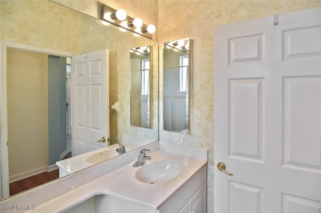 bathroom featuring vanity and wood-type flooring