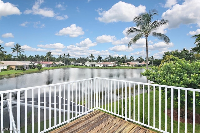 wooden deck featuring a water view