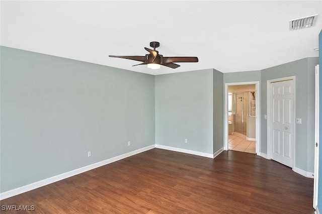 empty room featuring ceiling fan and wood-type flooring